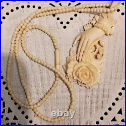 Necklace Victorian Rose in Hand Love Token or Memento Mori Hand Carved Bovine