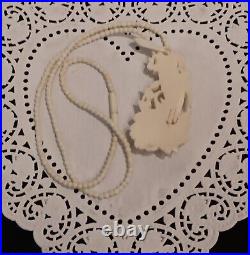 Necklace Victorian Rose in Hand Love Token or Memento Mori Hand Carved Bovine