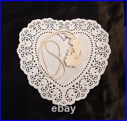 Necklace Victorian Rose in Hand Love Token or Memento Mori Hand Carved Bovine