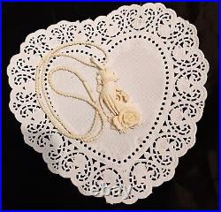 Necklace Victorian Rose in Hand Love Token or Memento Mori Hand Carved Bovine