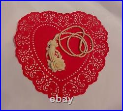 Necklace Victorian Rose in Hand Love Token or Memento Mori Hand Carved Bovine