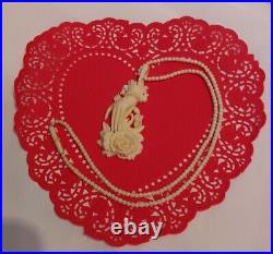 Necklace Victorian Rose in Hand Love Token or Memento Mori Hand Carved Bovine