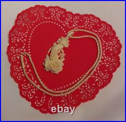 Necklace Victorian Rose in Hand Love Token or Memento Mori Hand Carved Bovine