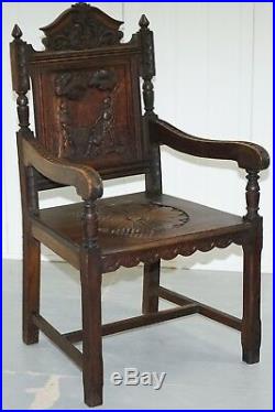 Victorian 1840 Gothic Revival Hand Carved Armchair Depicting Knights Duelling