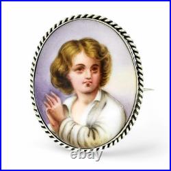 Victorian hand-painted porcelain portrait boy brooch, twisted rope silver frame